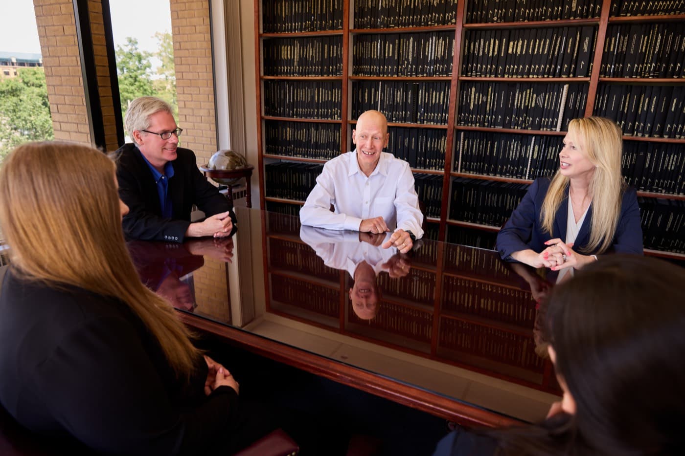 Santangelo & Ressue attorneys meeting in the firm's law library